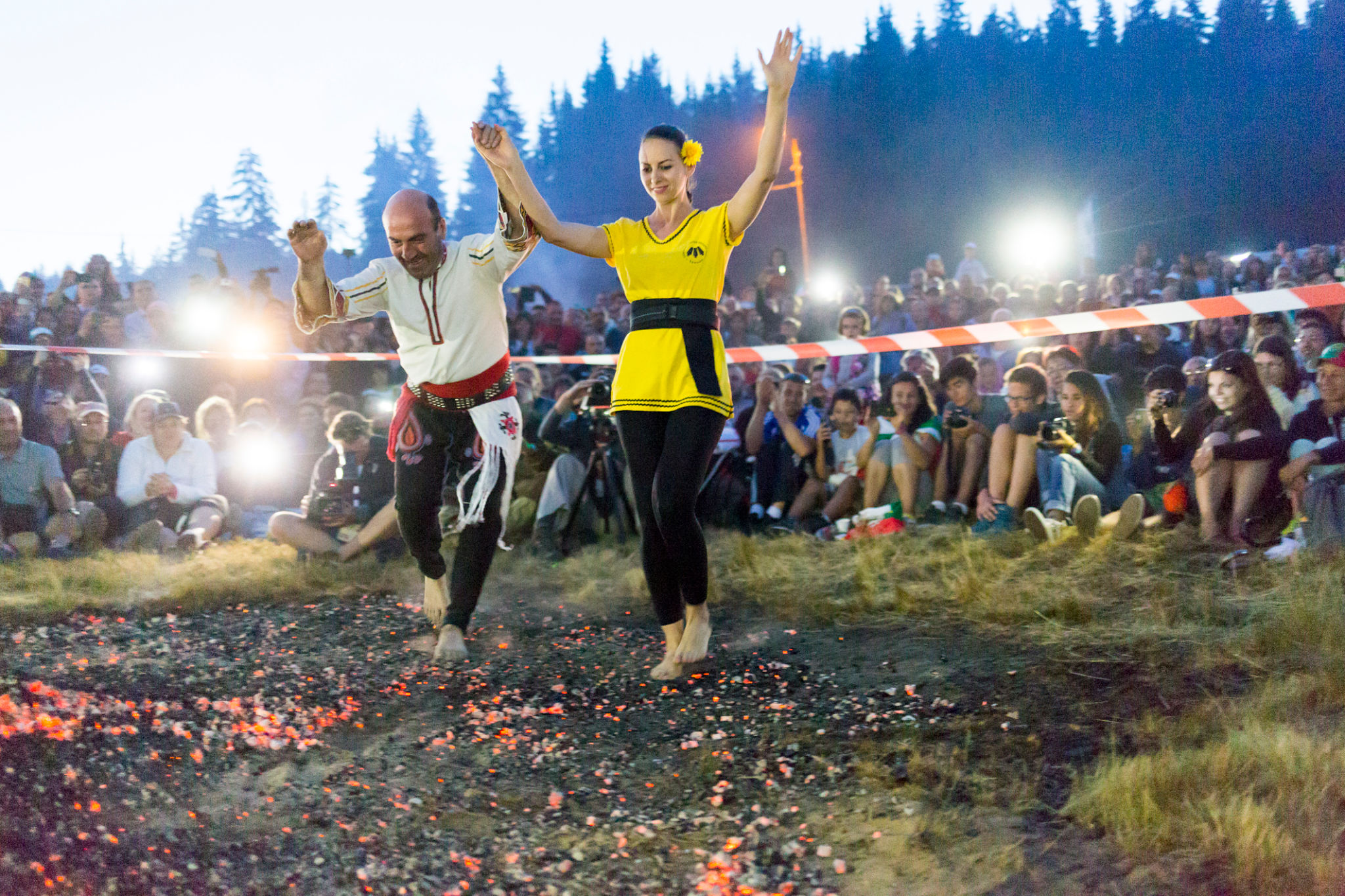 Nestinari man and woman walking on fire Nestinari man and woman walking on fire
