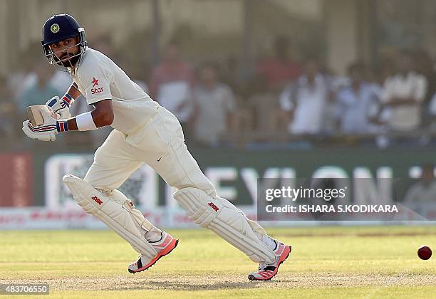 Indian cricket team captain Virat Kohli runs between the wickets during the first day of the opening Test match between Sri Lanka and India at the...