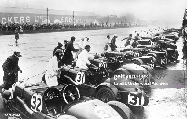 Drivers sprinting to their race cars after the starting signal for the great International Double Twelve Hours Race at Brooklands Track, London,...