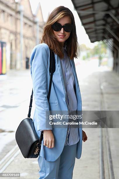 Carmen Hamilton wearing Hansen and Gretel suit, Zara men shirt, Karen Walker sunglasses and Dylan Kain bag at Mercedes-Benz Fashion Week Australia...