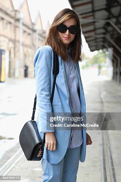 Carmen Hamilton wearing Hansen and Gretel suit, Zara men shirt, Karen Walker sunglasses and Dylan Kain bag at Mercedes-Benz Fashion Week Australia...