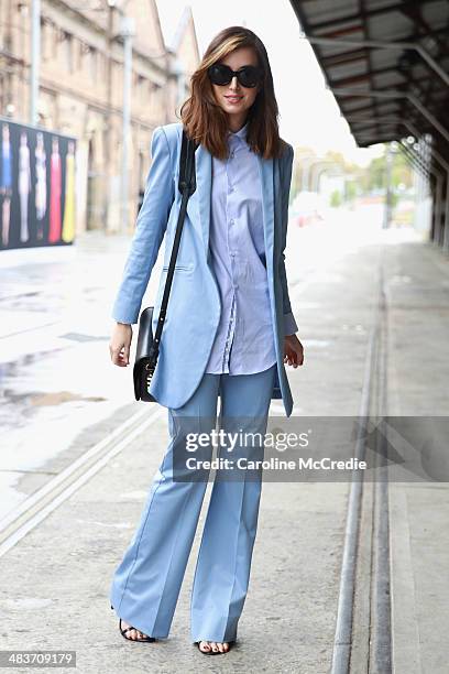 Carmen Hamilton wearing Hansen and Gretel suit, Zara men shirt, Karen Walker sunglasses and Dylan Kain bag at Mercedes-Benz Fashion Week Australia...