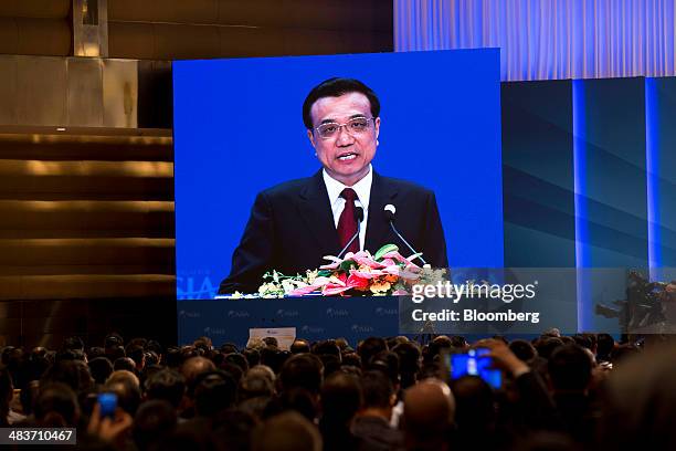 Li Keqiang, China's premier, is seen on a screen as he delivers a speech at the Boao Forum for Asia in Boao, Hainan, China, on Thursday, April 10,...