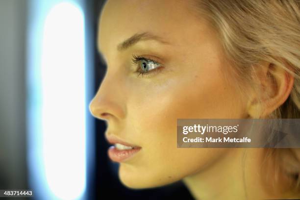 Model prepares backstage ahead of the Aje show at Mercedes-Benz Fashion Week Australia 2014 at Carriageworks on April 10, 2014 in Sydney, Australia.