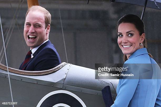 Catherine, Duchess of Cambridge watches Prince William, Duke of Cambridge sit in a plane as they attend a WW1 commemorative and Flying Day at Omaka...
