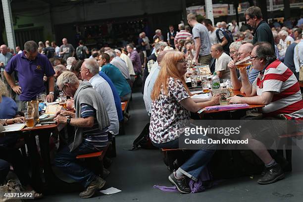 Punters enjoy the CAMRA Great British Beer festival at Olympia London exhibition centre on August 12, 2015 in London, England. The five day event is...
