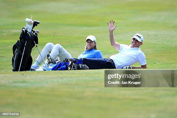 Gary Hendley of Stepaside Golf Centre and Ben Daniels of Bletchingley GC has a rest during slow play on day one of the Golfbreaks.com PGA Fourball...
