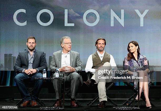 Executive producers Ryan Condal, Carlton Cuse, actors Josh Holloway and Sarah Wayne Callies speak onstage during the USA Networks 'Colony' panel...