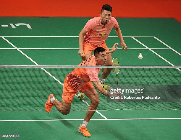 Chai Biao and Hong Wei of China compete against Takeshi Kamura and Keigo Sonoda of Japan in the 2015 Total BWF World Championship at Istora Senayan...