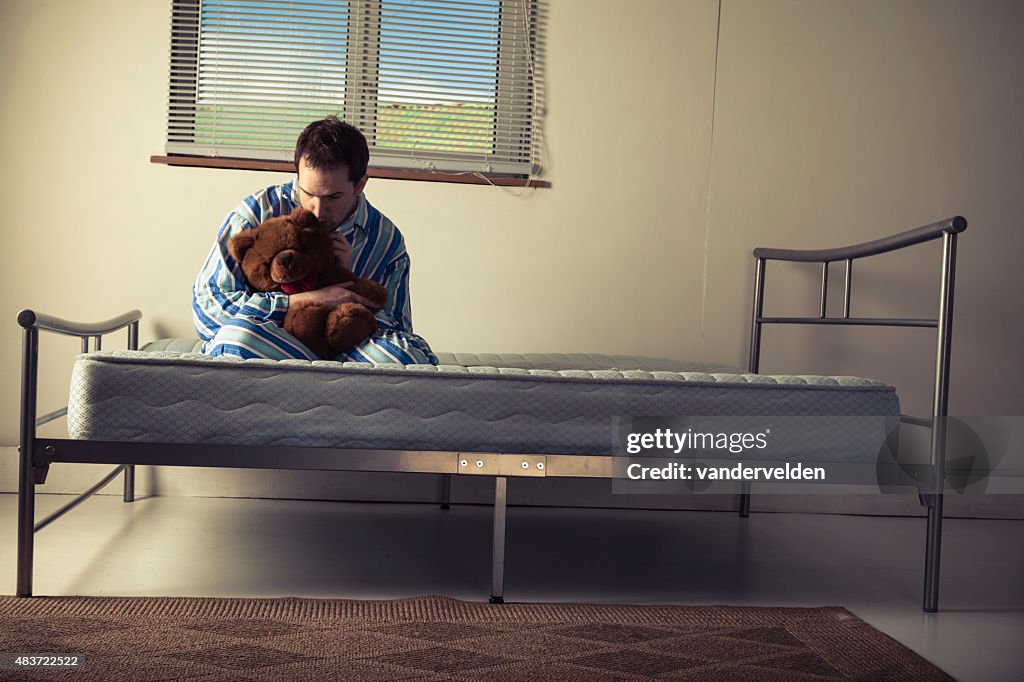 Lunatic In Striped Pyjamas With A Teddy Bear