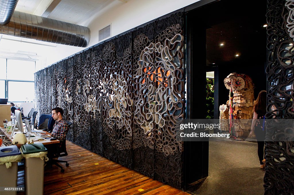 An art installation wall is seen as employees work at Etsy Inc.... News ...