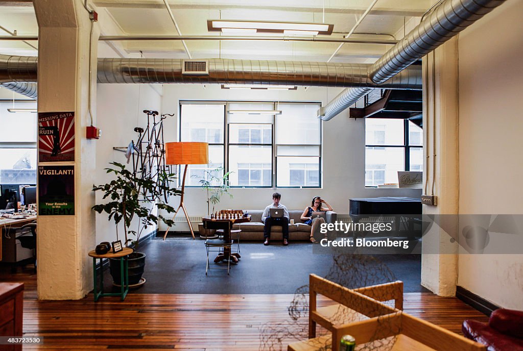 Employees work on Apple Inc. laptops at Etsy Inc. headquarters in the ...