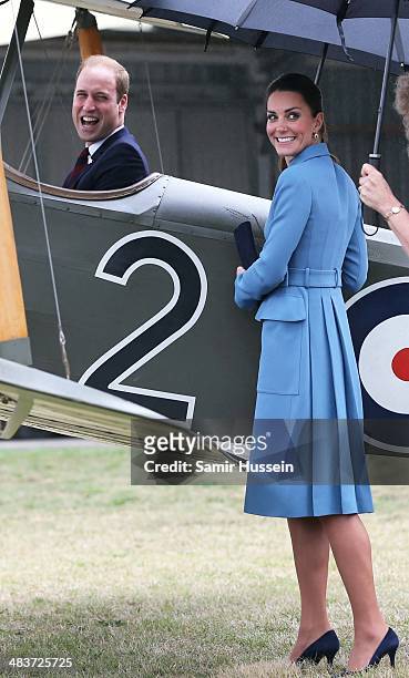 Catherine, Duchess of Cambridge watches Prince William, Duke of Cambridge sit in a plane as they attend a WW1 commemorative and Flying Day at Omaka...
