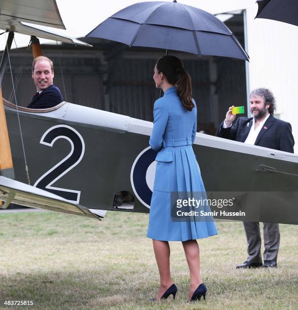 Sir Peter Jackson takes a photo of Prince William, Duke of Cambridge as Catherine, Duchess of Cambridge looks on in a plane at a WW1 commemorative...