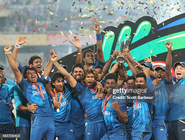 Lasith Malinga of Sri Lanka and his team celebrate with the trophy on the podium after winning the Final of the ICC World Twenty20 Bangladesh 2014...