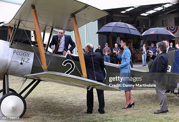 Catherine, Duchess of Cambridge and Prince William, Duke of Cambridge are filmed by Sir Peter Jackson on his phone at the "Knights of the Sky"...