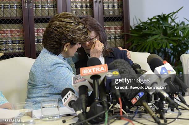 Attorney Gloria Allred comforts Linda Ridgeway Whitedeer, one of two women accusing comedian Bill Cosby with sexual assault and one woman accusing...