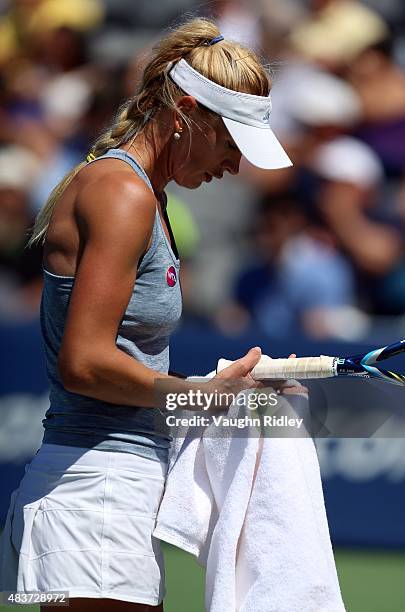 Olga Govortsova of Belarus drys her hands during her match against Ana Ivanovic of Serbia on Day 3 of the Rogers Cup at the Aviva Centre on August...
