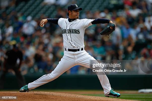 Starting pitcher Hisashi Iwakuma of the Seattle Mariners pitches against the Baltimore Orioles in the first inning at Safeco Field on August 12, 2015...