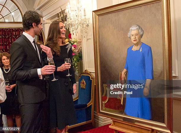 New Zealand artist Nick Cuthell and Catherine, Duchess of Cambridge share a joke as they attend an art unveiling of a portrait of Queen Elizabeth II...