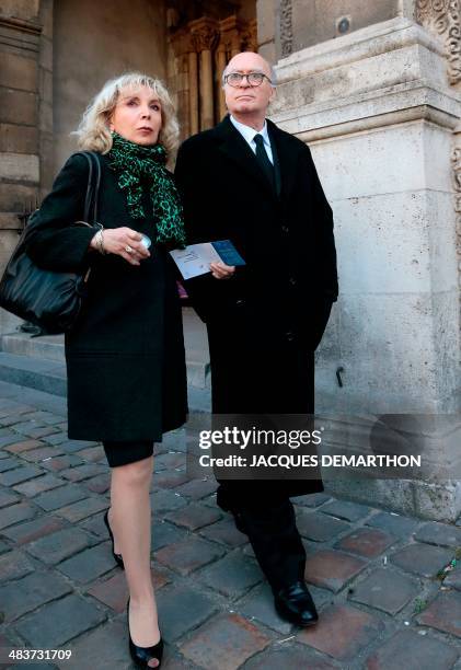 French cartoonist Georges Wolinski and wife Maryse leave the church after attending French author Regine Deforges's funeral on April 10, 2014 in...