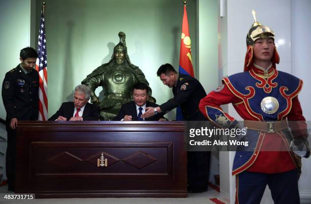 Secretary of Defense Chuck Hagel and Mongolian Defense Minister Dashdemberal Bat-Erdene participate in a signing ceremony of a joint vision statement...