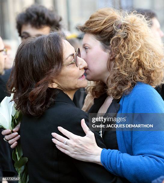Camille Deforges-Pauvert , the daughter of deceased French author Regine Desforges, is comforted by Nathalie Rykiel, CEO and creative director of the...