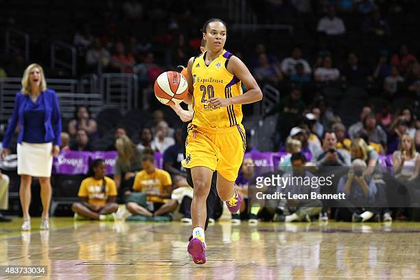 Kristi Toliver of the Los Angeles Sparks handles the ball against against of the Seattle Storm in a WNBA game at Staples Center on August 11, 2015 in...