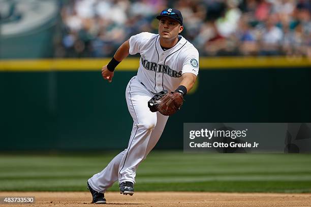 First baseman Jesus Montero of the Seattle Mariners reacts to a grounder against the Texas Rangers at Safeco Field on August 8, 2015 in Seattle,...