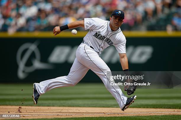 First baseman Jesus Montero of the Seattle Mariners reacts to a grounder against the Texas Rangers at Safeco Field on August 8, 2015 in Seattle,...