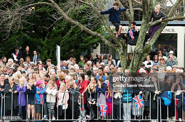 Crowds gather to see Catherine, Duchess of Cambridge and Prince William, Duke of Cambridge attend a wreathlaying service at the War Memorial in...