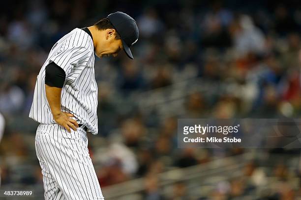 Masahiro Tanaka of the New York Yankees reacts after giving up a three-run home run to Jonathan Schoop of the Baltimore Orioles in the second inning...