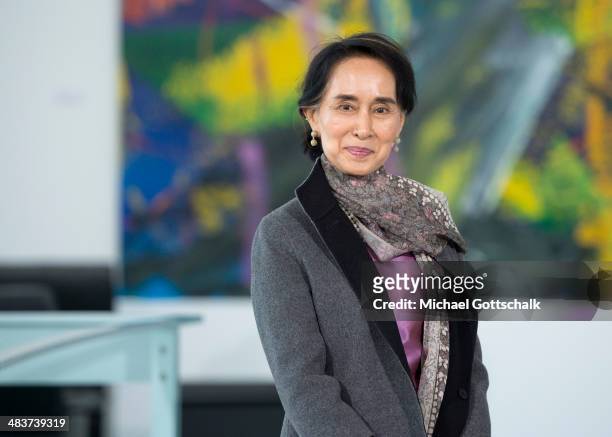 Myanmar human rights activist and politician Aung San Suu Kyi poses as she meets German Chancellor Angela Merkel in the Chancellery on April 10, 2014...