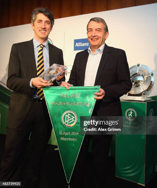 Bernd Heinemann board member of Allianz Germany and head of market management, and DFB President Wolfgang Niersbach pose during a press conference on...