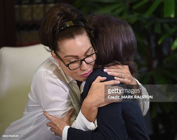 Former actress Eden Tirl who is one of three new alleged sexual assault victims of comedian Bill Cosby consoles Linda Ridgeway Whitedeer during a...