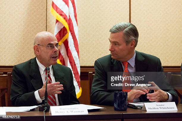 Bicameral Task Force On Climate Change co-chairs Rep. Henry Waxman and Sen. Sheldon Whitehouse talk with each other during a discussion about climate...