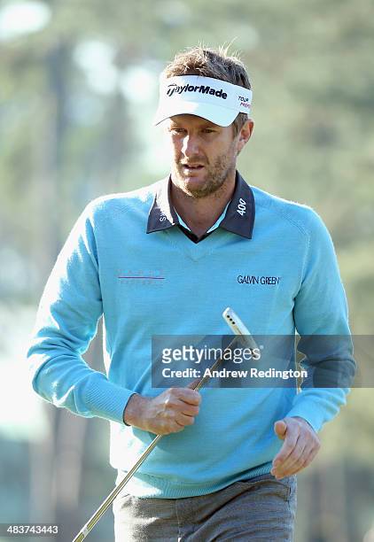 David Lynn of England walks across the first green during the first round of the 2014 Masters Tournament at Augusta National Golf Club on April 10,...