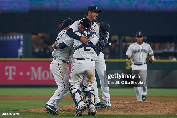 Starting pitcher Hisashi Iwakuma of the Seattle Mariners reacts after throwing a no-hitter to defeat the Baltimore Orioles 3-0 at Safeco Field on...