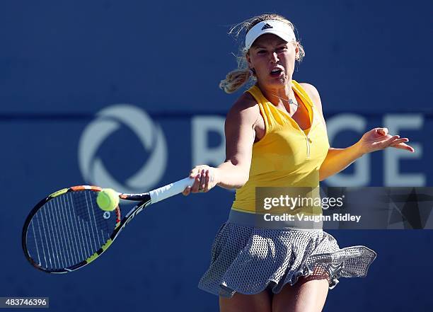 Caroline Wozniacki of Denmark plays a shot against Belinda Bencic of Switzerland during Day 3 of the Rogers Cup at the Aviva Centre on August 12,...