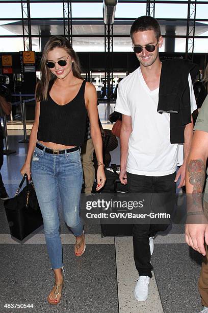 Miranda Kerr and Evan Spiegel are seen at LAX. On August 12, 2015 in Los Angeles, California.