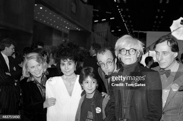 Celebrities Liz Smith, Yoko Ono, Sean Ono Lennon, Keith Haring, Andy Warhol and Andre Gregory attend an AIDS Benefit in April 1986 in New York City,...