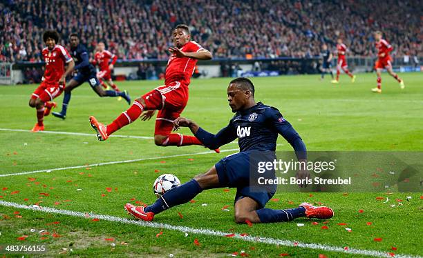 Patrice Evra of Manchester United centers the ball during the UEFA Champions League Quarter Final second leg match between FC Bayern Muenchen and...