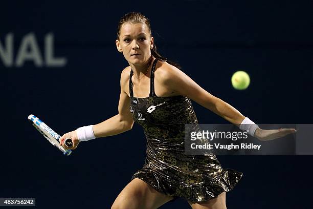 Agnieszka Radwanska of Poland plays a shot against Julia Goerges of Germany during Day 3 of the Rogers Cup at the Aviva Centre on August 12, 2015 in...