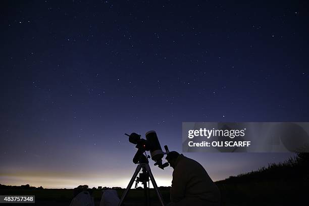 Members of the York Astronomical Society prepare to view the annual Perseids meteor shower in the village of Rufforth, near York, northern England on...