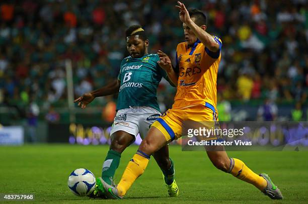 Jorge Torres of Tigres struggles for the ball with Jonathan Gonzales of Leon during a 4th round match between Leon and Tigres UANL as part of the...