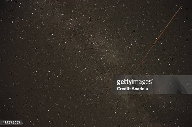 Perseid meteors streak across the sky over Inegol district of Bursa, Turkey on August 12, 2015. The display, known as the Perseid shower because the...