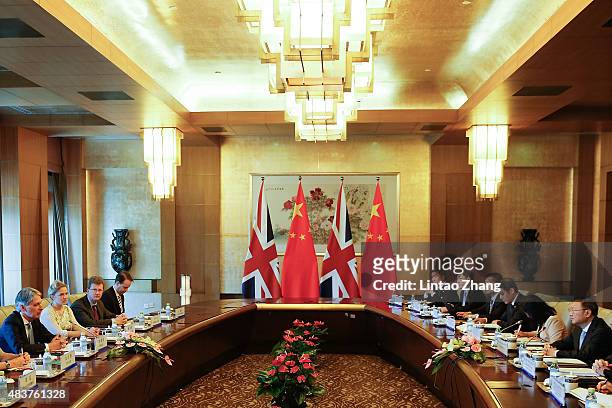 British Foreign Secretary Philip Hammond speaks with Chinese State Councilor Yang Jiechi during the China-UK Strategic Dialogue at the Diaoyutai...