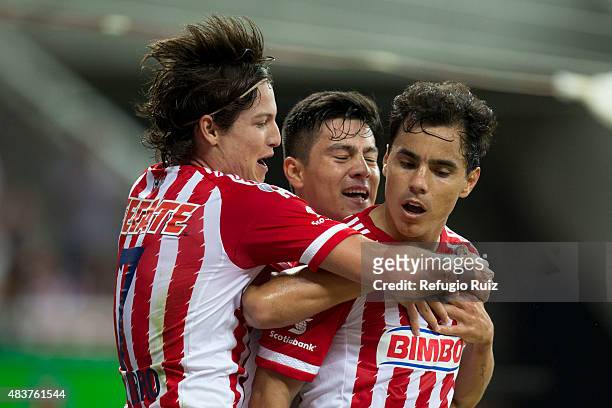 Omar Bravo celebrates with teammates after scoring the second goal of his team during a 4th round match between Chivas and Morelia as part of the...