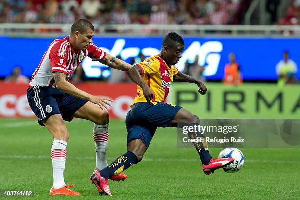 Jorge Enriquez of Chivas fights for the ball with Jefferson Cuero of Morelia during a 4th round match between Chivas and Morelia as part of the...