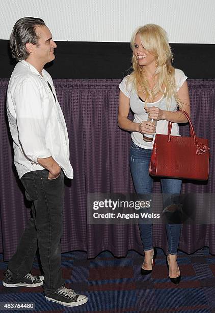 Actors Joaquin Phoenix and Pamela Anderson attend the screening of "Unity" directed by Shaun Monson at Universal CityWalk on August 12, 2015 in...